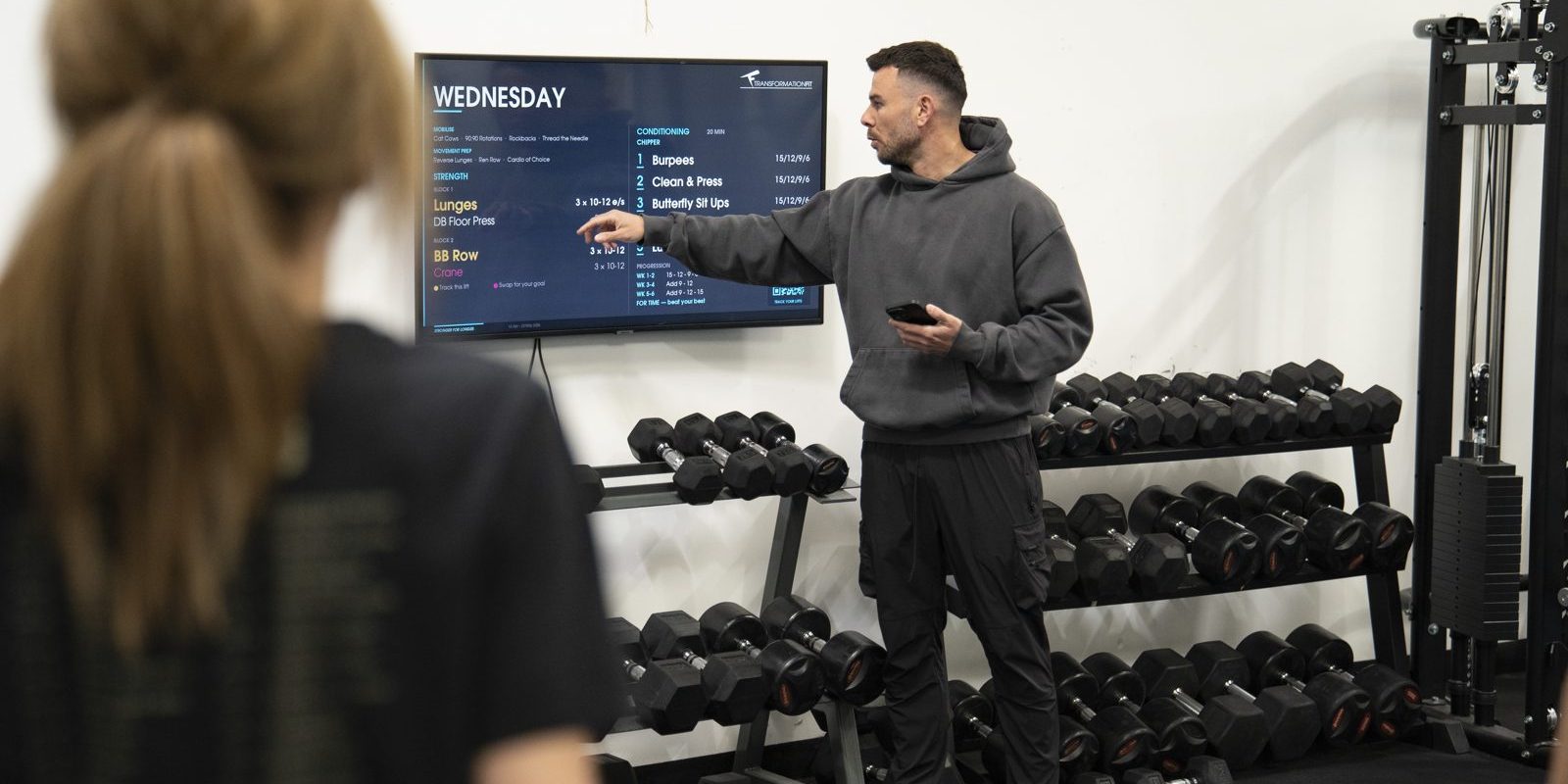Strength training over 50 Leicester Strength training over 50 in Leicester: coach explaining the session plan at Transformation Fit